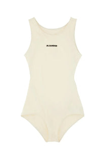 Cream-colored sleeveless one-piece bodysuit with black jil sander branding on chest for women