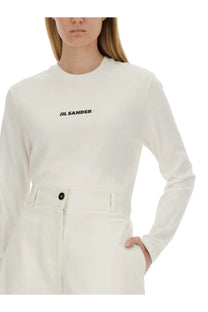 Jil Sander women’s minimalist white long-sleeved shirt with subtle black logo embroidery on the chest