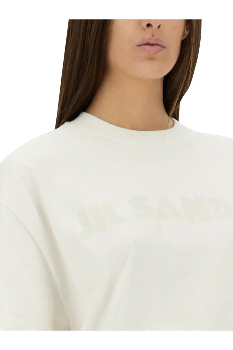 White jil sander women’s crewneck sweatshirt with subtle faded lettering across the chest in soft cotton material
