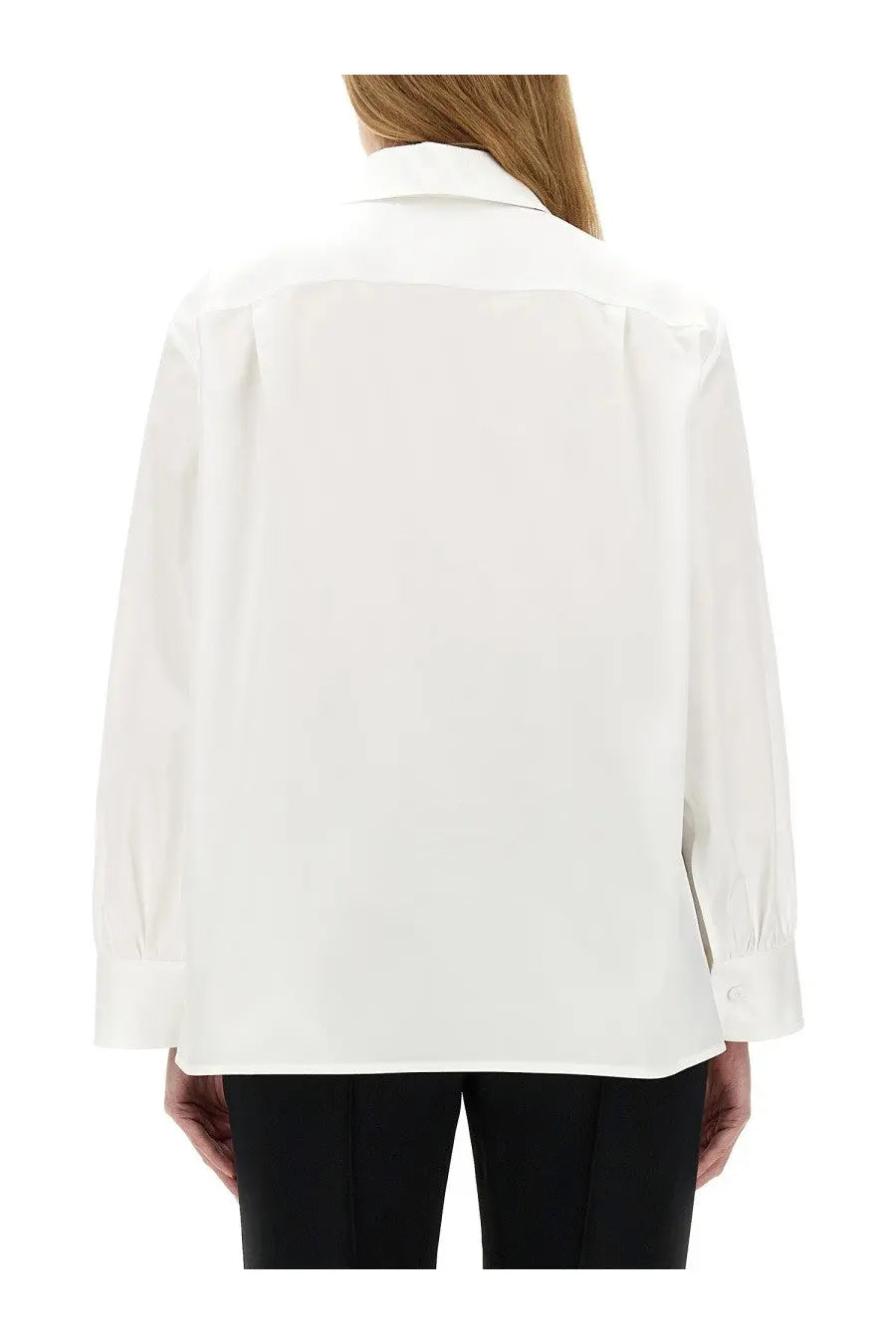 A crisp white jil sander women’s shirt with long sleeves, button-down front, classic collar, and subtle shoulder pleats