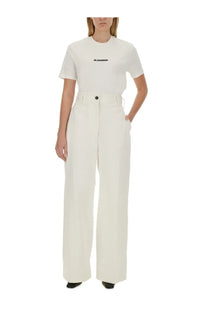White high-waisted wide-leg trousers with button closure and belt loops from jil sander women’s shirt collection