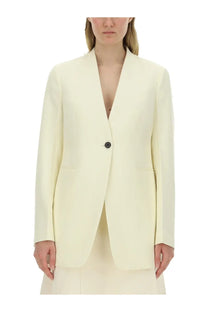Jil Sander women’s cream-colored tailored blazer with a single black button and clean lines in pink collection