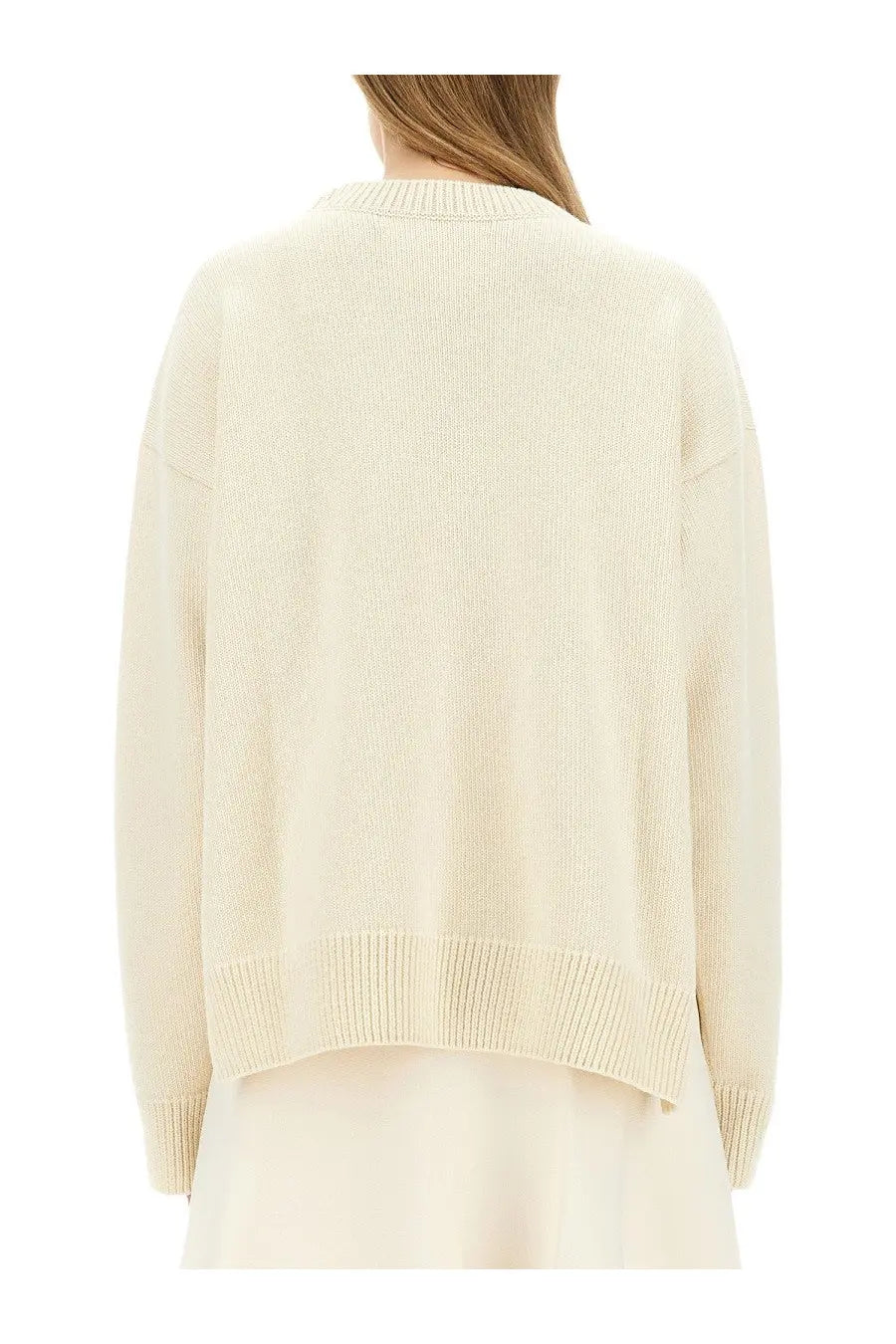 Cream-colored jil sander women’s wool sweater with ribbed knit, relaxed fit, and crew neckline in white
