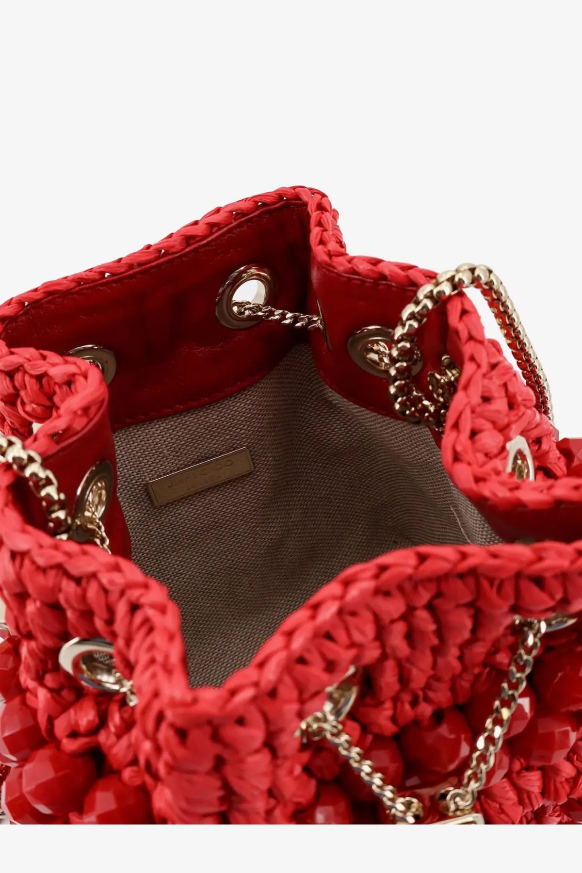 Red crocheted raffia bucket bag with gold-tone chain straps and decorative beads by jimmy choo women