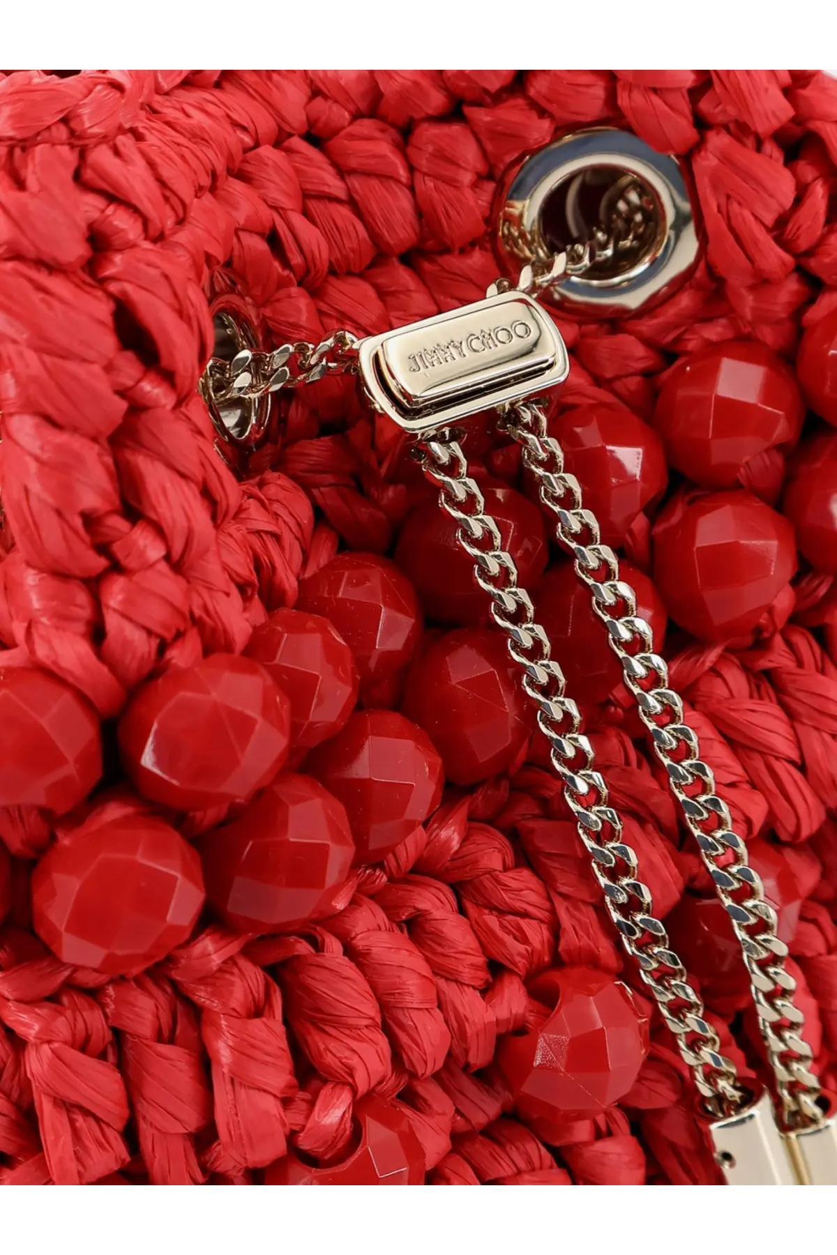 Jimmy Choo women’s bon bon raffia bucket bag red with vibrant woven straw and silver chain strap with logo plaque