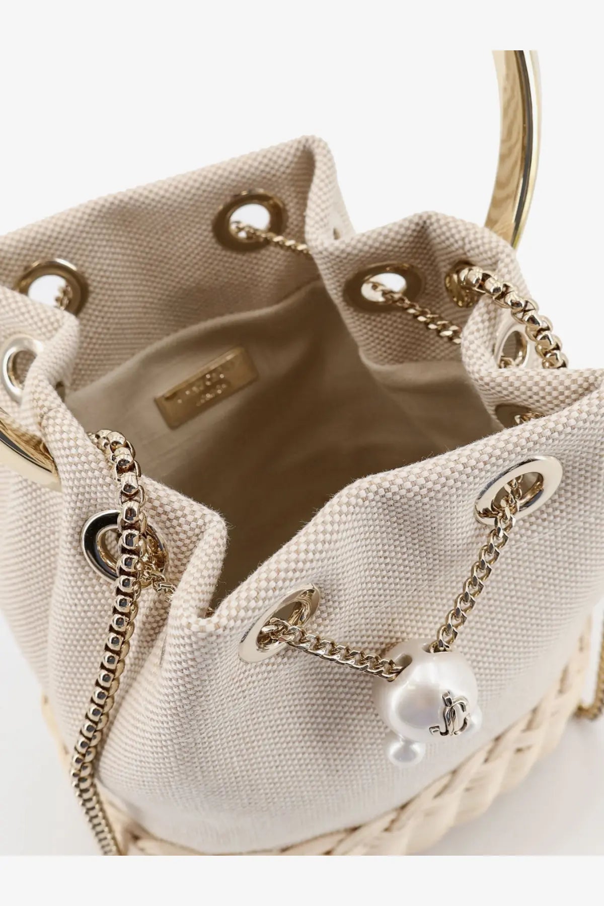 Jimmy Choo women’s beige canvas bucket bag with gold hardware and pearl accent in raffia and canvas multicolor design