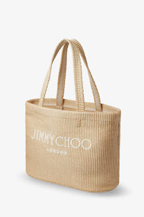 Beige woven raffia jimmy choo london tote bag with white embroidery in a shopping bag design for women