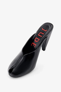 Black patent leather jude women’s paw mule sandal with red jude logo on the insole