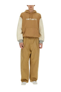 Tan and cream colorblock carhartt hoodie with ribbed cuffs from junya watanabe man in beige cotton blend material