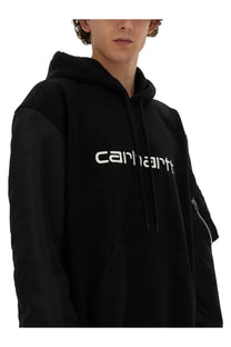 Black Carhartt hoodie by Junya Watanabe Man featuring white logo and zipper detail on sleeve in cotton material