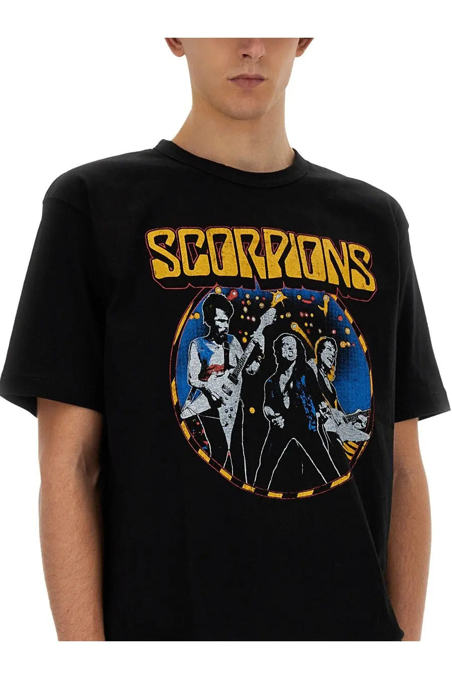 Black cotton Junya Watanabe man t-shirt with vibrant scorpions band graphic and yellow lettering on front