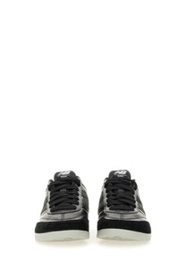 Black new balance junya watanabe man men’s sneaker with glossy leather upper suede accents and white rubber soles