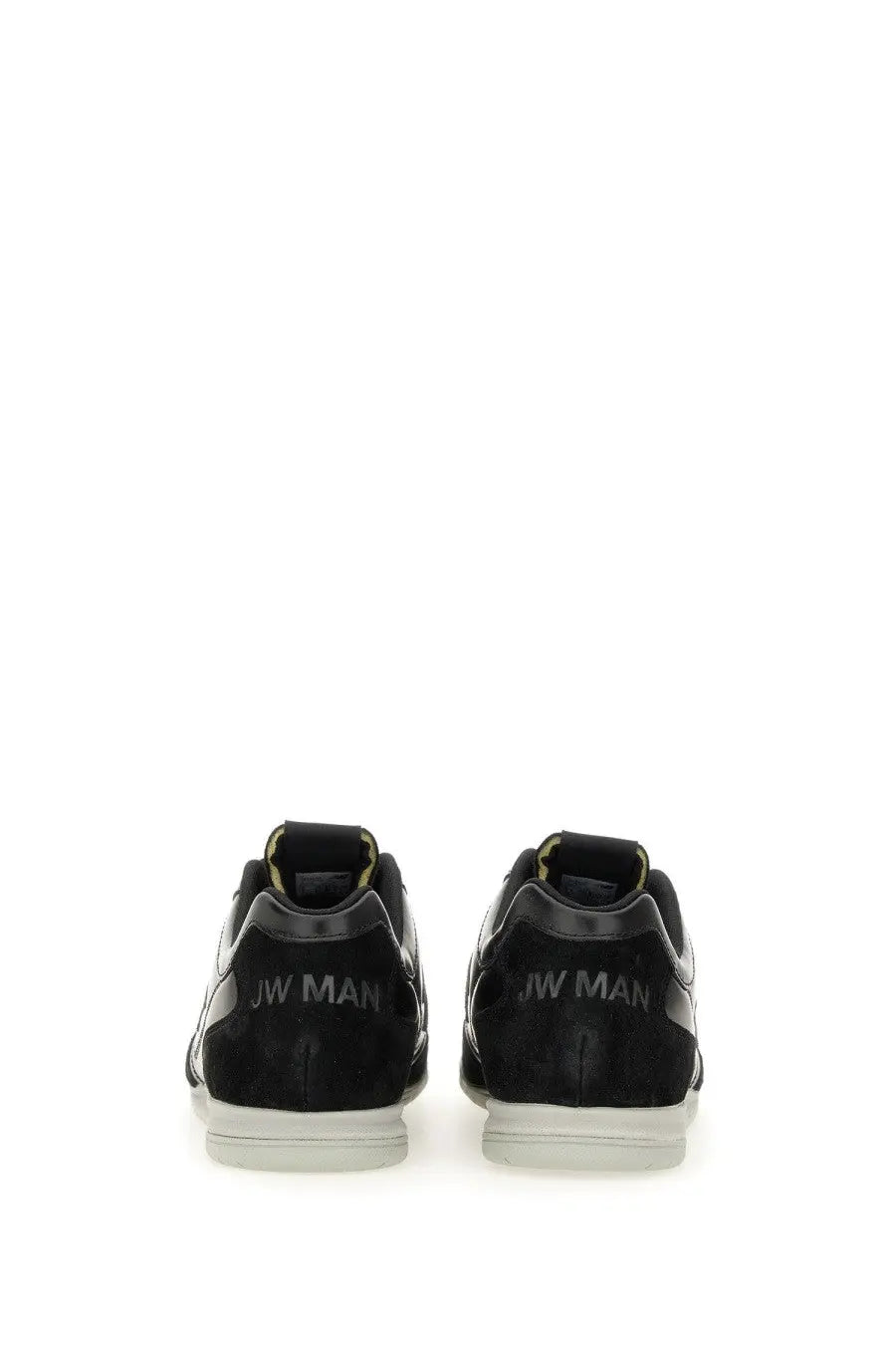 Black suede and leather jw man sneakers with white soles and subtle yellow accents from Junya Watanabe Man