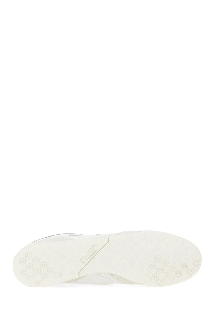 White rubber sole with circular tread patterns on junya watanabe man mens sneaker rc42 new balance white