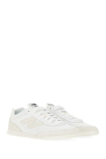 White new balance junya watanabe man sneaker rc42 with minimalist design and beige logo and sole accents