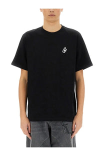 Jw Anderson men’s black short-sleeved cotton t-shirt with small white embroidered anchor logo on left chest