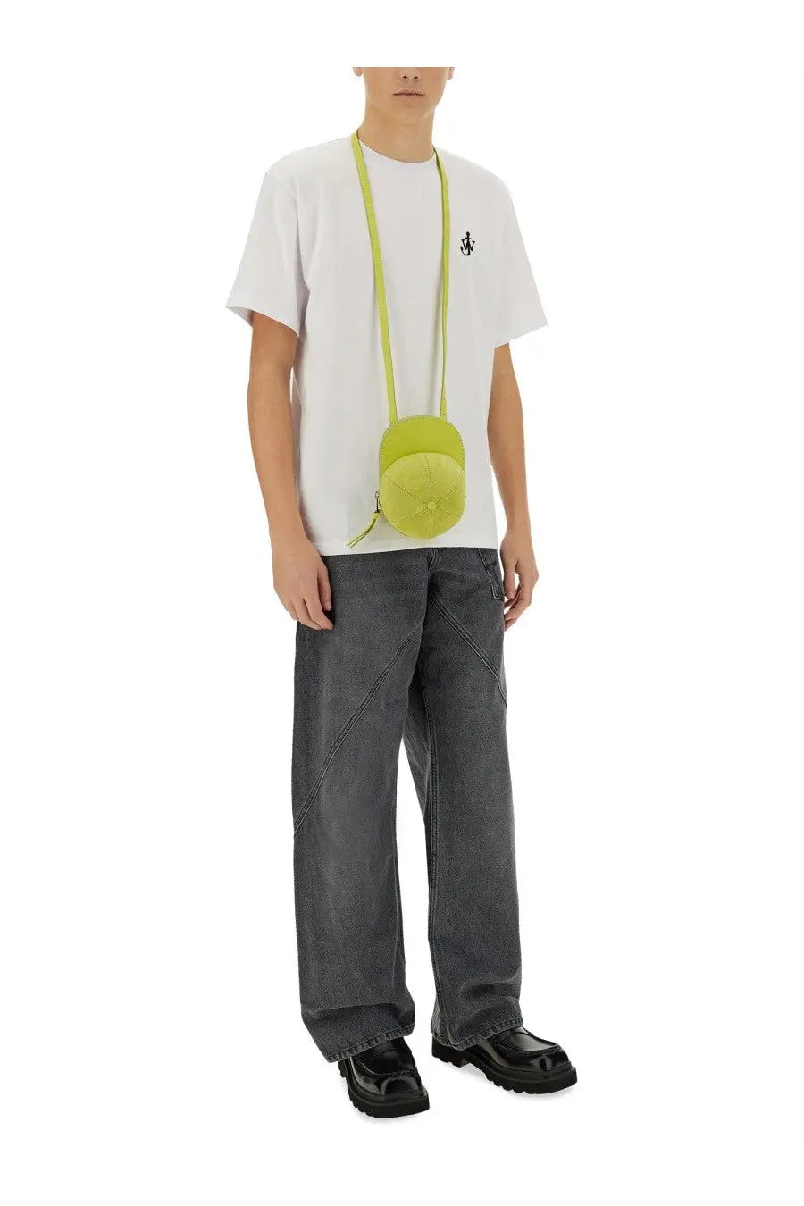 A lime green round crossbody bag with matching strap styled with jw anderson men’s anchor shirt white