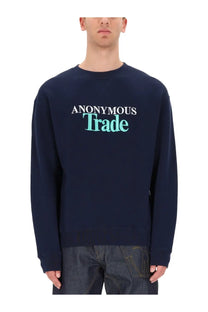 Navy blue JW Anderson men’s crewneck sweatshirt with anonymous trade print in white and teal across the chest