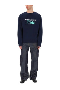 Navy blue JW Anderson men’s long sleeve sweatshirt with white and teal anonymous trade print on chest
