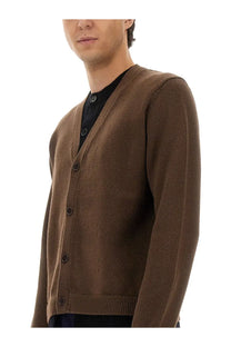 Jw anderson men’s brown knit cardigan with dark buttons and ribbed cuffs for layered style