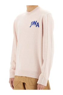 Jw anderson men’s jersey blue soft blush pink knit sweater with ribbed crew neck and blue embroidered jwa lettering