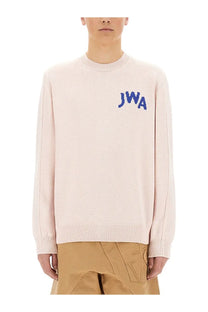 Jw anderson men’s jersey blue soft blush pink knit sweater with ribbed crew neck cuffs and embroidered blue jwa lettering
