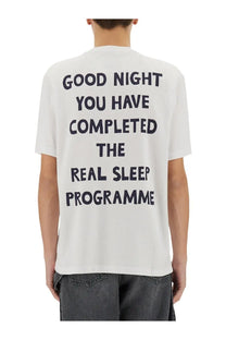 Back of jw anderson men’s white cotton t-shirt with bold black text about completing the real sleep programme