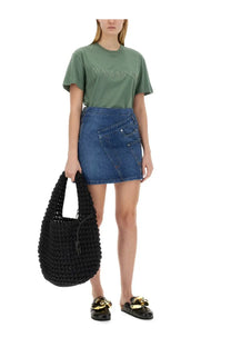 Black crocheted tote bag with drawstring closure paired with jw anderson women’s blue denim miniskirt