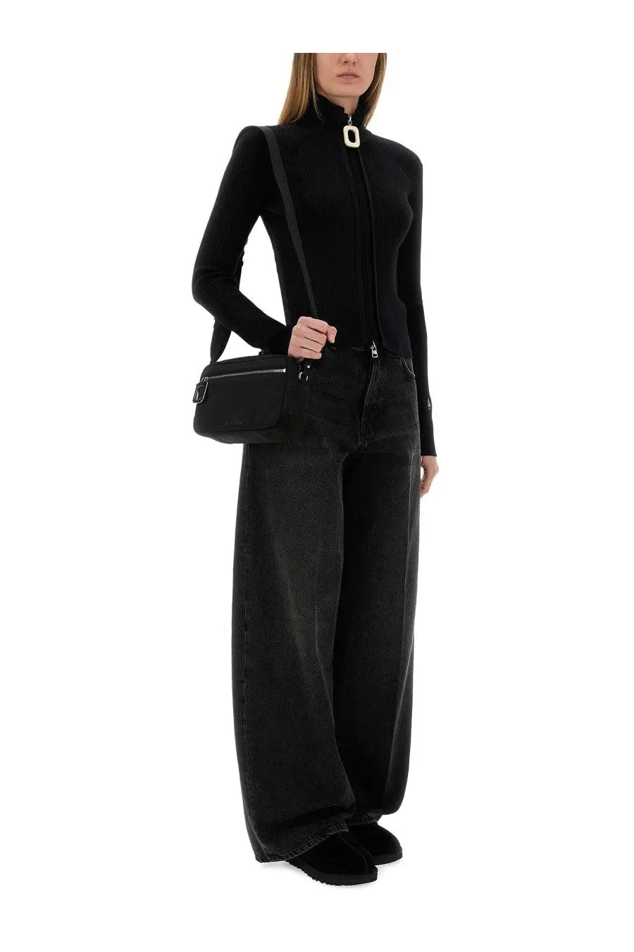 Jw anderson women’s fitted cardigan black shown with a black crossbody bag featuring white oval clasp and silver zippers