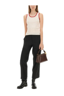 Brown leather mini handbag with gold-tone hardware complementing jw anderson women’s white knitted vest