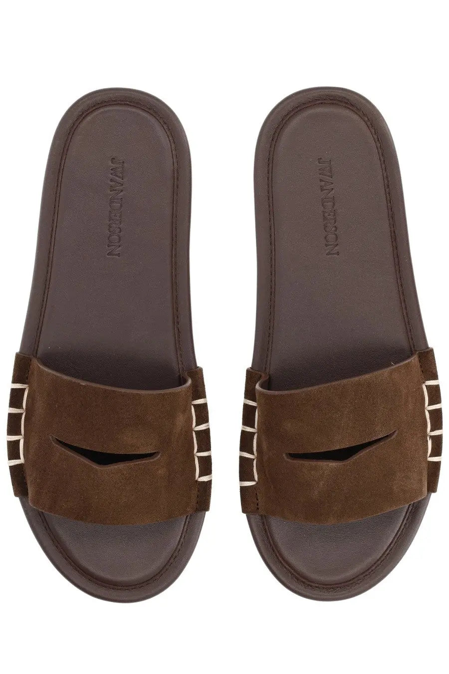 Jw anderson women’s brown leather slide sandals with a stitched strap and white vertical stripes on the sides