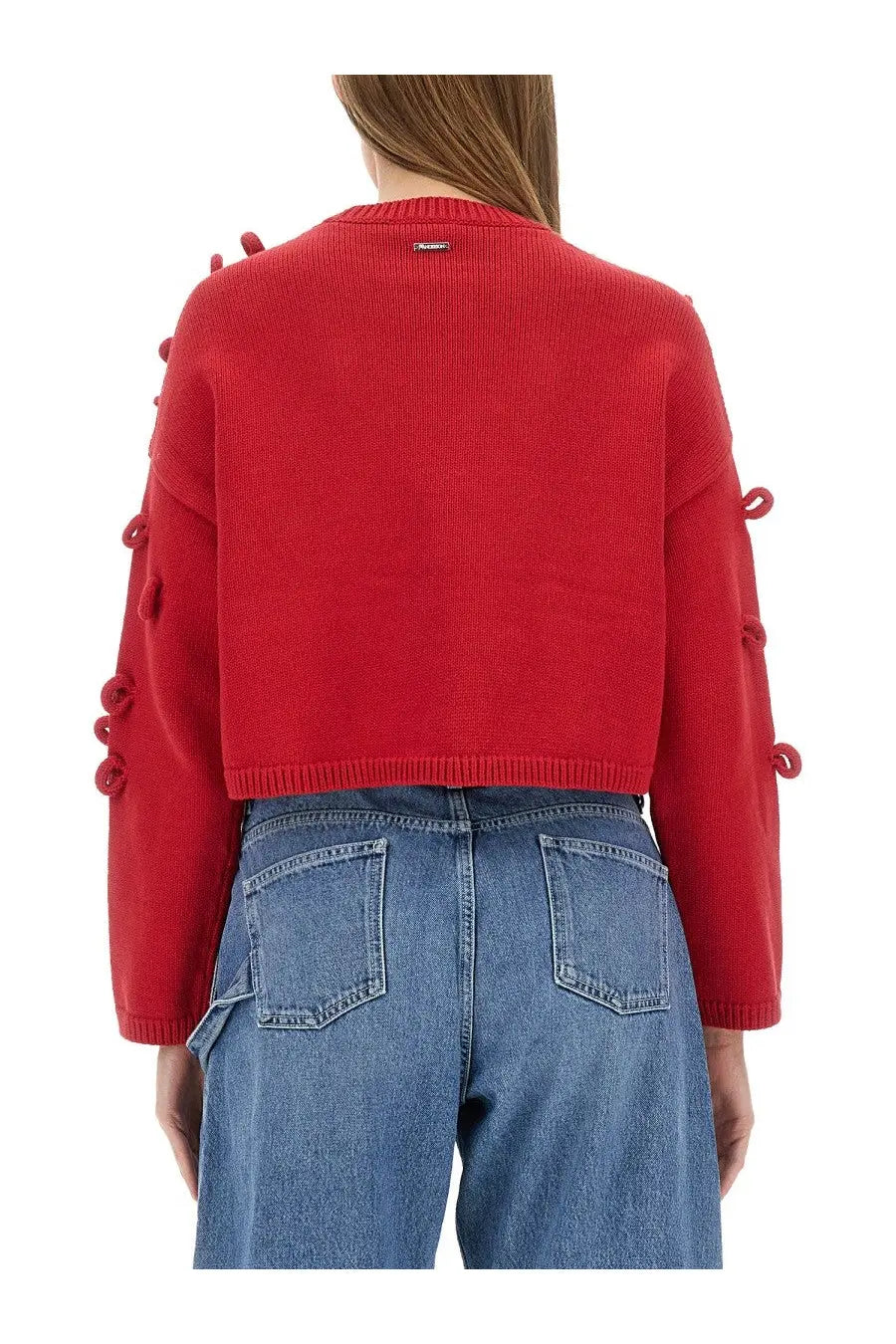 Jw anderson women’s red knitted cropped sweater with decorative button embellishments along the sleeves