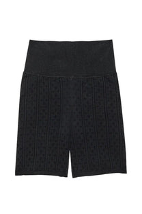 Jw anderson women’s perforated knit shorts in black featuring high-waisted design and subtle vertical ribbing