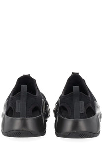 Black balenciaga triple s sneakers with a sleek textured knit upper and bold rubber sole for stylish wear