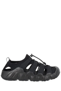 Keen men’s sandal hyperport black in black rubber and mesh with a rugged textured sole shown from the back side