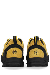 Back view of keen men’s sneaker jasper zionic yellow yellow suede with black rubber sole and embroidered flower logo