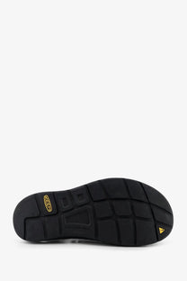 Back view of keen men’s uneek suede sneakers green showing black rubber sole with textured grid and gold keen logo