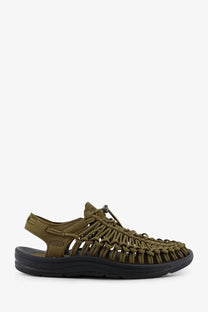 Keen men’s Uneek suede sneakers in olive green woven leather with black rubber sole and brand logo visible