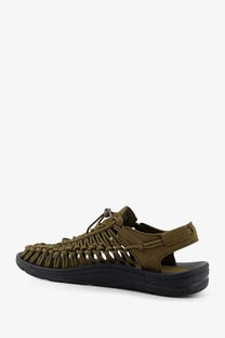 Keen men’s uneek suede sneakers green featuring olive green woven sandals with black rubber sole and adjustable strap closure