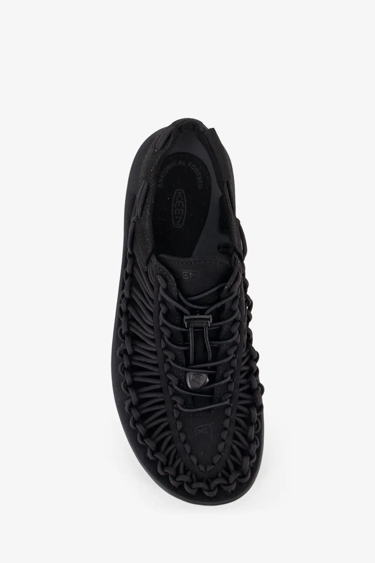 Keen men’s uneek woven fabric sandals in black featuring black woven leather with braided lacing and a minimalist design