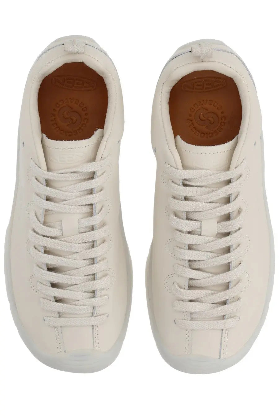 Cream-colored leather keen women’s jasper se1 sneaker with white laces and matching sole for casual wear
