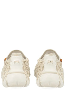 Keen women’s sneaker uneek white cream-colored mesh sneakers with chunky sole and orange-tipped laces