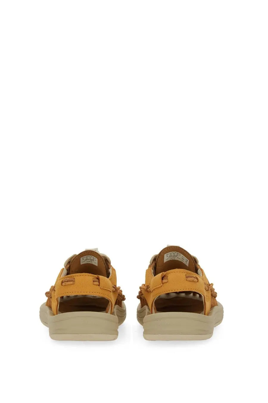 Keen women’s uneek oak sandal in mustard yellow leather with brown accents and chunky off-white sole