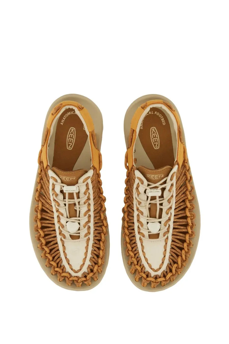Tan and white woven leather keen women’s uneek oak sandal with braided design and keen logo on the insole