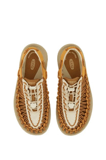 Tan and white woven leather keen women’s uneek oak sandal with braided design and keen logo on the insole