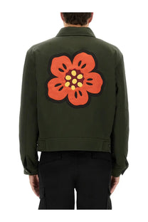 Back of olive green kenzo men’s boke flower padded bomber jacket with orange yellow and dark brown flower patch