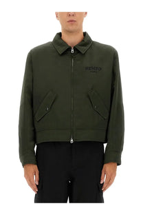 Olive green Kenzo Paris men’s bomber jacket with black embroidered logo and silver zipper accents in padded design