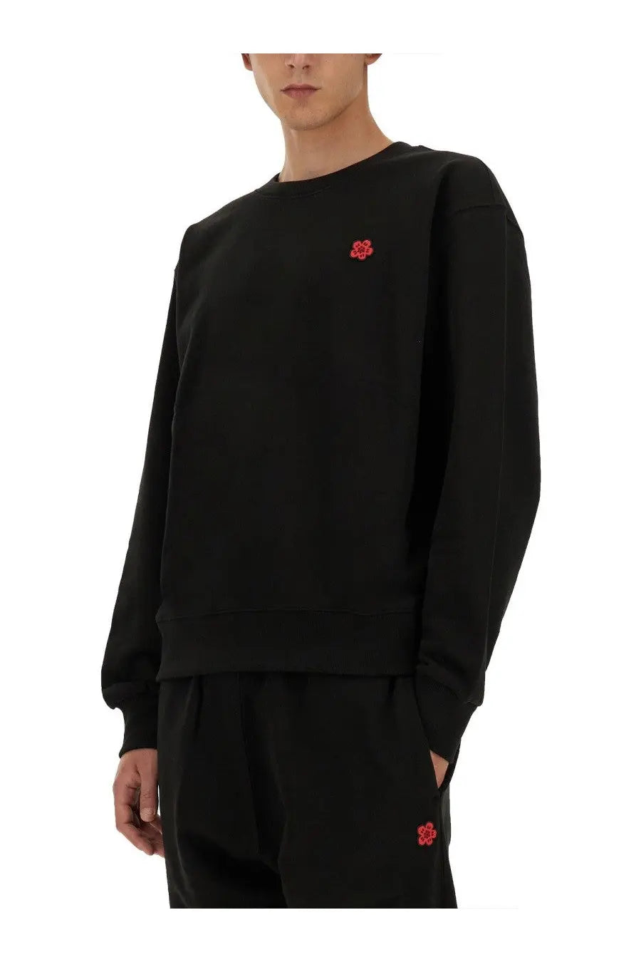Kenzo men’s black crewneck sweatshirt with red embroidered boke flower logo on chest and matching patch on leg