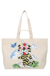 Beige canvas kenzo men’s large tote bag with playful cartoon tiger, black stripes, pink heart eyes, red tongue, blue bird, and clouds