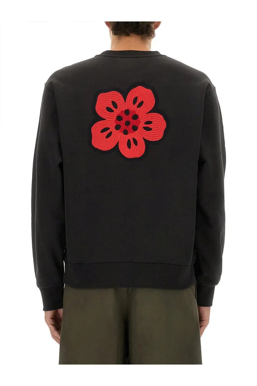 Kenzo men’s classic black sweatshirt with bold red crocheted flower patch on the back side